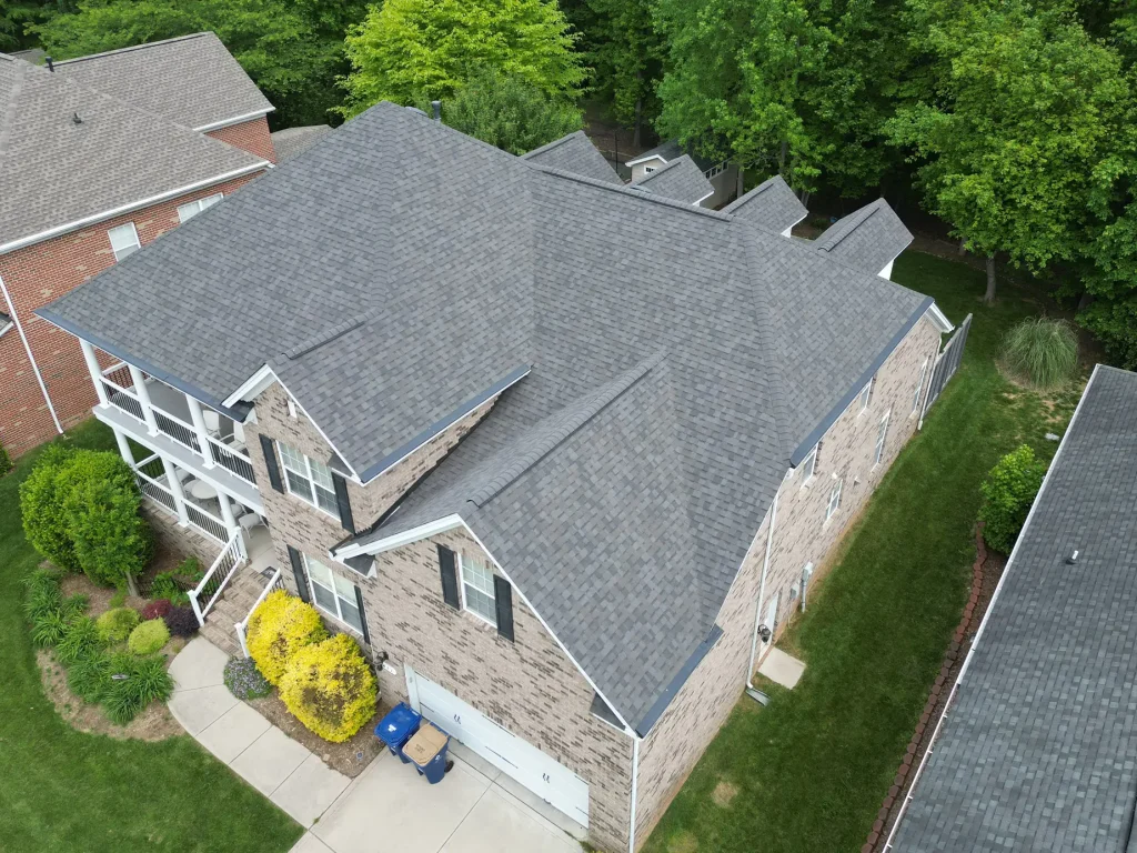 Aerial view of a completed roof replacement in Waxhaw, NC with Williamsburg Gray shingles